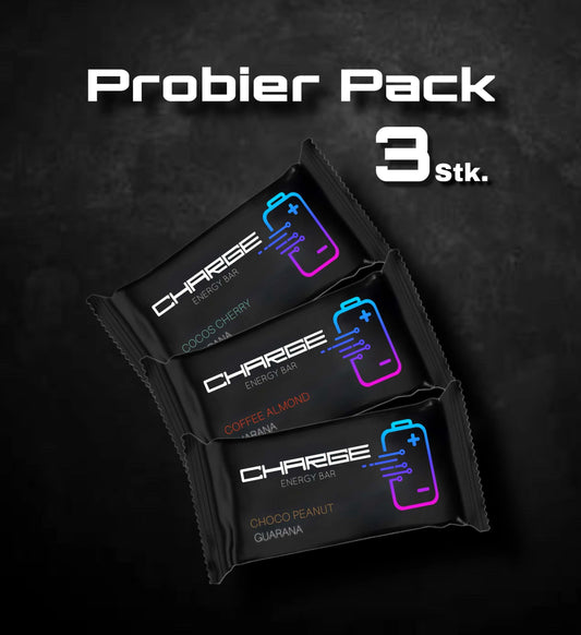 Charge Energy Bar Riegel für Unterwegs. Perfekt für Motorrad, Fahrrad, Rennrand, Wandern, Ski, Schule, Uni. Der leckere Snack mit Energie für Unterwegs. Schwarze Verpackung mit einer leuchtenden Batterie